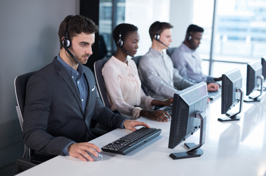 Attentive customer service executives working at office