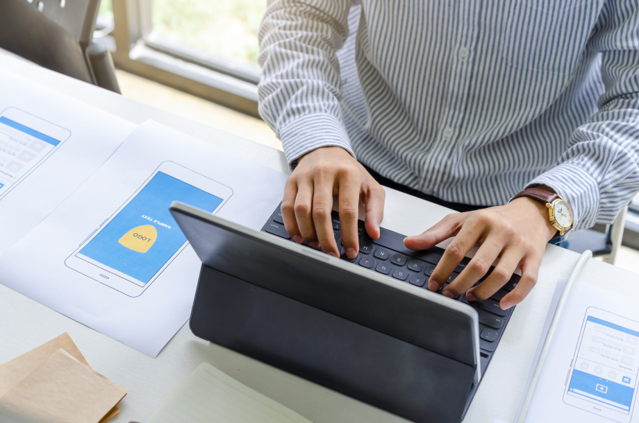 A man operates a computer